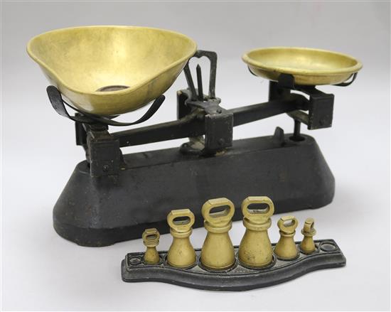 A set of Victorian brass and black painted cast iron scales and weights